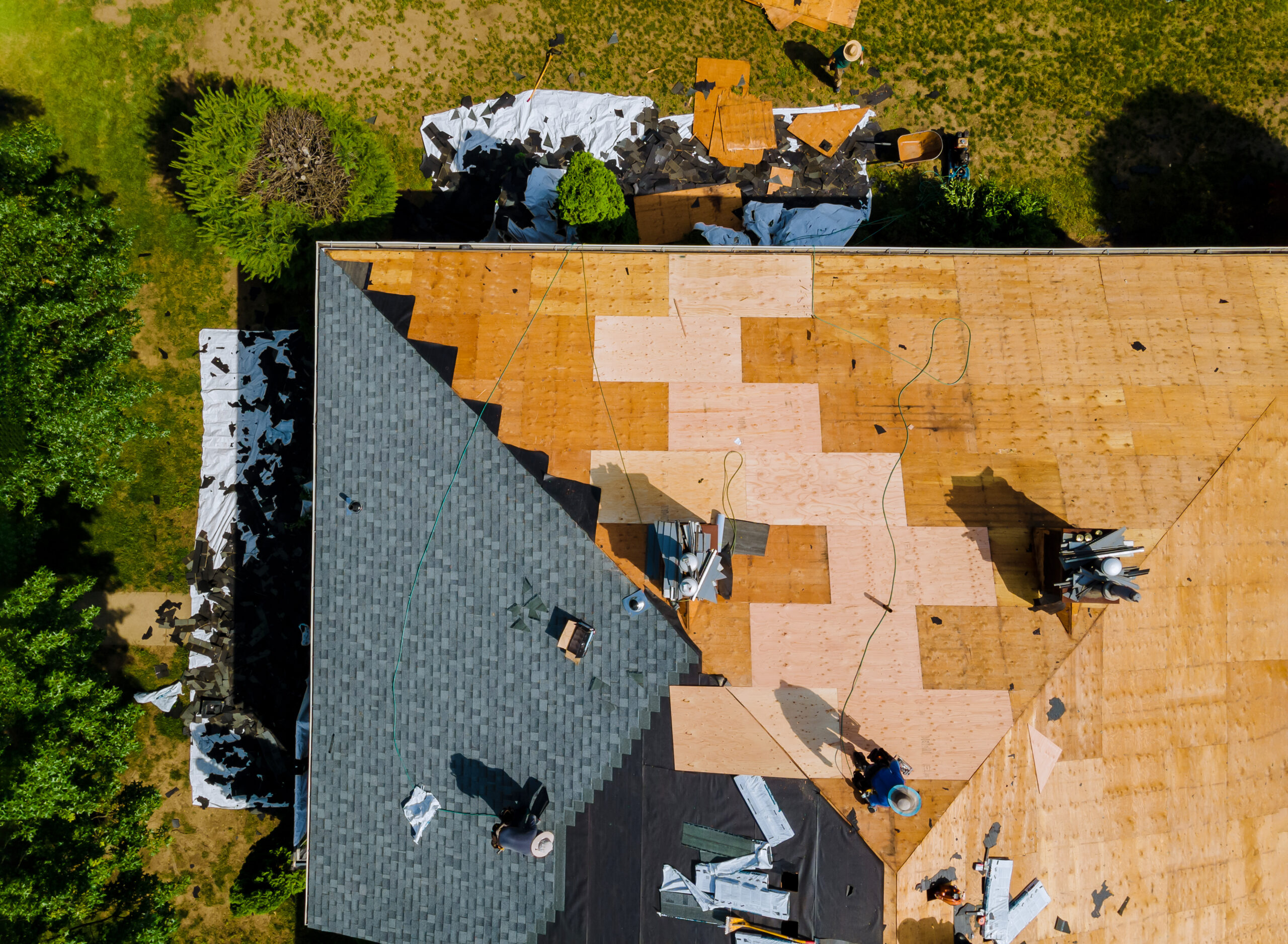 Aerial view of a roof being constructed on a residential home